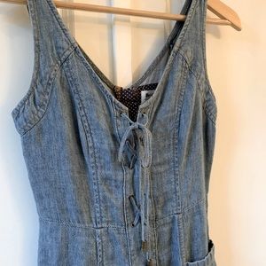 Anthropologie Holding Horses brand denim dress with lace-up detail and pockets.